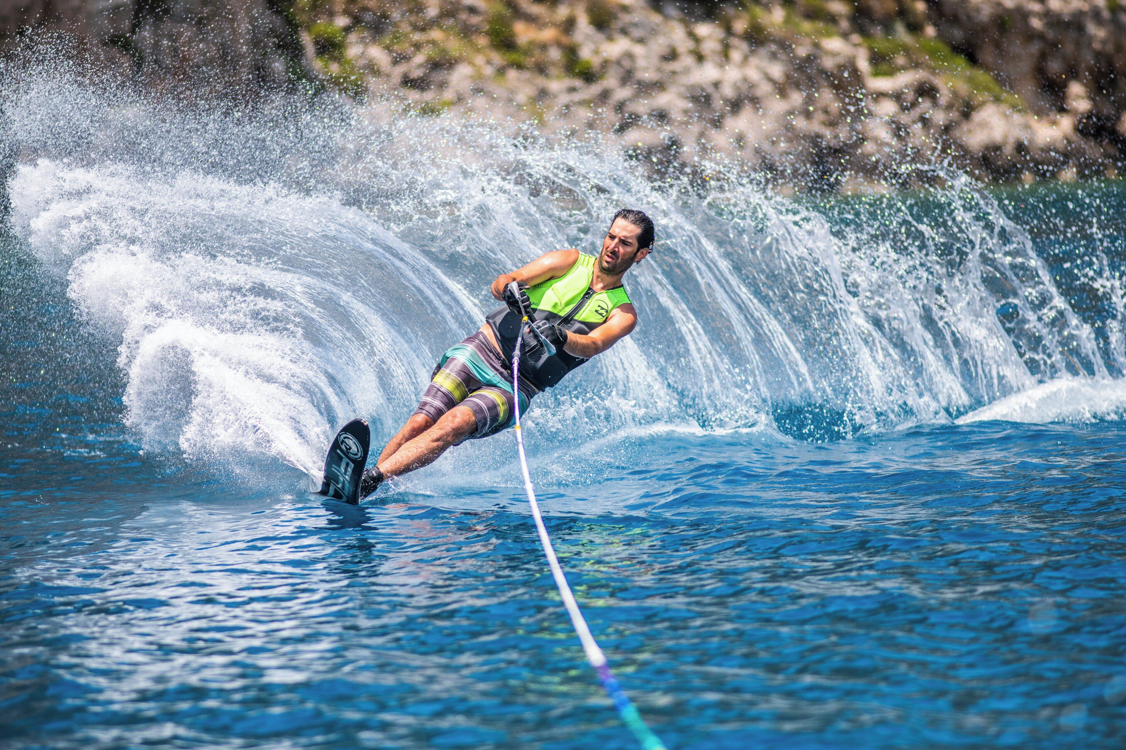 A person water skiing on a clear day.