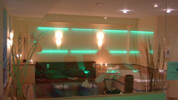 Guests can enjoy a serene view of the spa area from the large window.