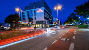 A modern building with a prominent "LOGINN" sign, indicating a hotel or business complex. - Loginn Hotel Waiblingen (Waiblingen)