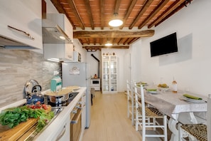 Family Apartment, 2 Bedrooms, 2 Bathrooms (Podere del Ciacchi Among Tuscany) | Private kitchen | Fridge, microwave, stovetop, coffee/tea maker