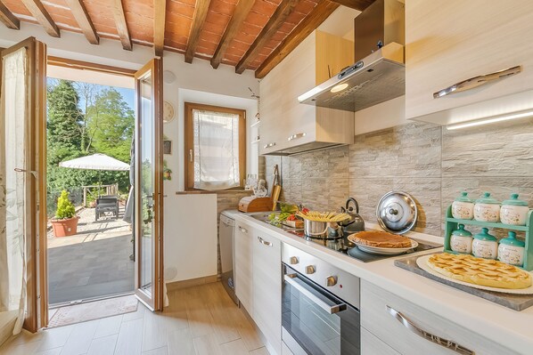 Family Apartment, 2 Bedrooms, 2 Bathrooms (Podere del Ciacchi Among Tuscany) | Private kitchen | Fridge, microwave, stovetop, coffee/tea maker