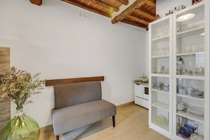 Family Apartment, 2 Bedrooms, 2 Bathrooms (Podere del Ciacchi Among Tuscany) | Living area | 21-inch flat-screen TV with satellite channels, TV