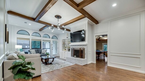 A spacious living room with a fireplace, a large TV, and a pool table. - 4 Bedroom3 Bath,Pool table, Pool, Crib (Plano)