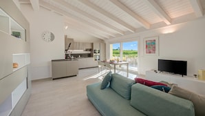 A modern interior with a kitchen, dining area, and living room. - Mirabelle - Apartment With Terrace & Views (Dro)
