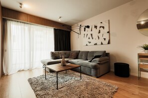 Premium Apartment | Living area | 101-cm plasma TV with cable channels, TV - Nest Inn Scala (Cluj-Napoca)