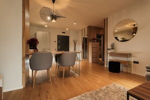 Premium Apartment | Living area | 101-cm plasma TV with cable channels, TV - Nest Inn Scala (Cluj-Napoca)