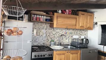 Fridge, stovetop, toaster, cookware/dishes/utensils