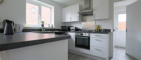 House, Multiple Beds | Private kitchen | Fridge, microwave, oven, stovetop