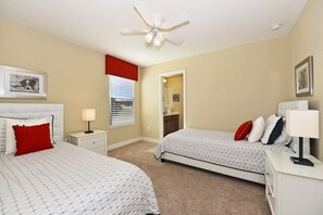 A bedroom with two beds, a ceiling fan, a window with blinds, and a closet. - Meticulous 6bd Spa Gm Pool Hm Solterra-4187od 6 Bedroom Home by RedAwning (Davenport)