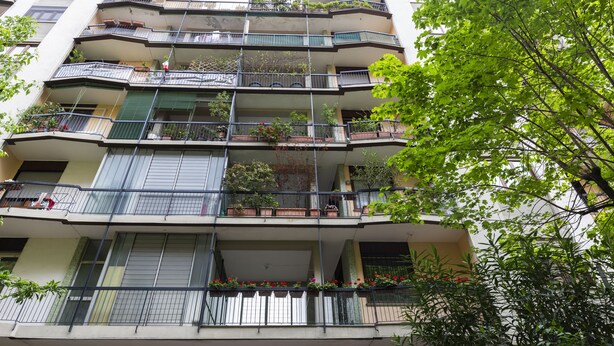 A multi-story residential building with balconies, some with railings and potted plants. - notaMI - CASA RELAX - Central Station (Milan)