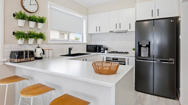 Fridge, microwave, dishwasher, coffee/tea maker