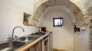 Fridge, stovetop, coffee/tea maker, cookware/dishes/utensils