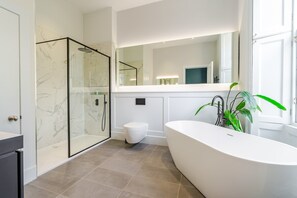 Bathtub, hair dryer, towels