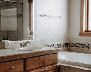 Shower, hair dryer, towels, shampoo