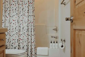 Shower, hair dryer, towels, shampoo
