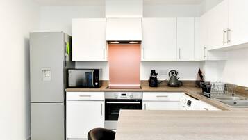 Fridge, microwave, oven, cookware/dishes/utensils