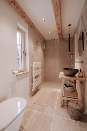 Shower, hair dryer, slippers, towels