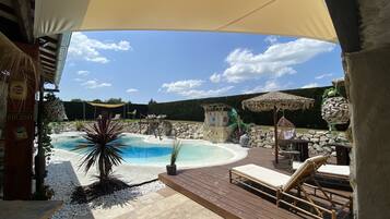 Seasonal outdoor pool, a heated pool, pool umbrellas, pool loungers