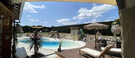 Seasonal outdoor pool, a heated pool, pool umbrellas, pool loungers