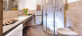 5 minutes from the Alpe di Siusi cable car, family apartment and terrace.