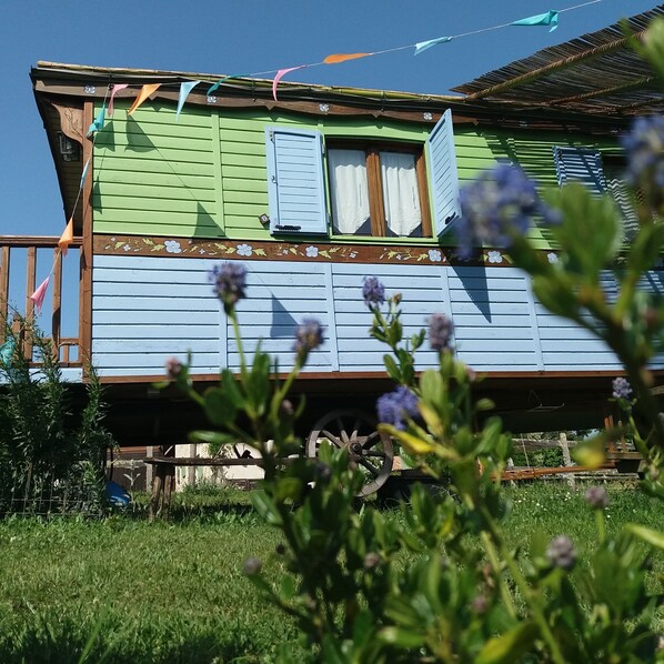 Enjoy a peaceful stay in this charming house with a balcony and lush lawn.