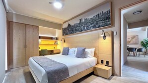 A modern bedroom with a large bed, bedside tables, a desk, and a cityscape painting on the wall. - Elegant refined stay near WTC | Terrace (Ciudad de México)