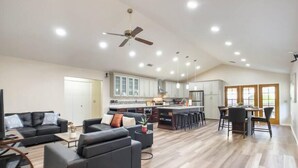 A spacious living area with a modern kitchen, a dining area, and a ceiling fan. - Immaculate!  Single-Story 3bdr | Chandler (Chandler)