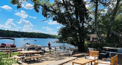 Chic Treehouse Cabin with Pedal Boat, Hot Tub, BBQ, Fire Pit, SUPs, & Lake Access