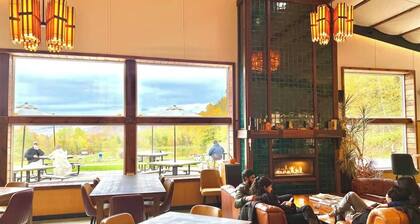 Chic Treehouse Cabin with Pedal Boat, Hot Tub, BBQ, Fire Pit, SUPs, & Lake Access