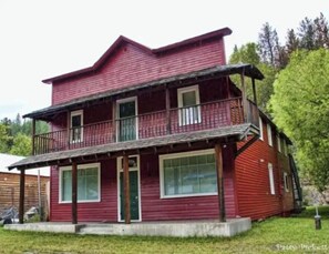 Stroll out to the front porch and enjoy the serene surroundings from the balcony above.