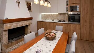 House (Three Bedroom Holiday Home with Swimm) | Private kitchen | Fridge, dining tables