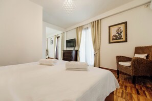 1 bedroom, desk, iron/ironing board, travel crib