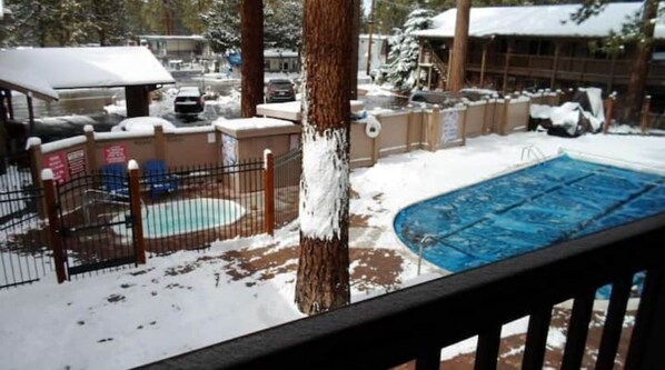 Guests can enjoy a refreshing swim in the pool surrounded by a scenic view.