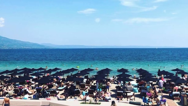 A crowded beach with numerous umbrellas and people enjoying the sunny weather. - Salina SPA Villas - with PRIVATE ECO-POOL, SAUNA & Hot Tub (Volos)