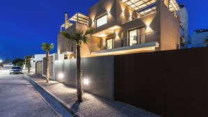 A modern multi-story building with large windows and a flat roof. - Salina SPA Villas - with PRIVATE ECO-POOL, SAUNA & Hot Tub (Volos)