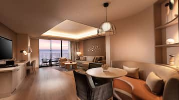 A modern hotel room with a balcony, a dining area, and a living space with a sofa and chairs.
