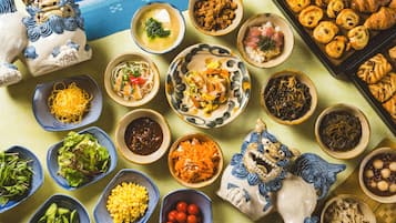 A variety of dishes and food items arranged on a table.
