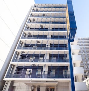 A multi-story building with a modern architectural design, featuring balconies and large windows. - Super Hotel Osaka Chikatesu Tanimachi-4chome (Osaka)