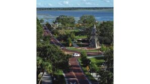 A coastal road with a park area, a statue, and a view of the sea. - Relax in the Countryside: Enjoy a Vacation in a 3 Bedroom Farm House! (Lucedale)