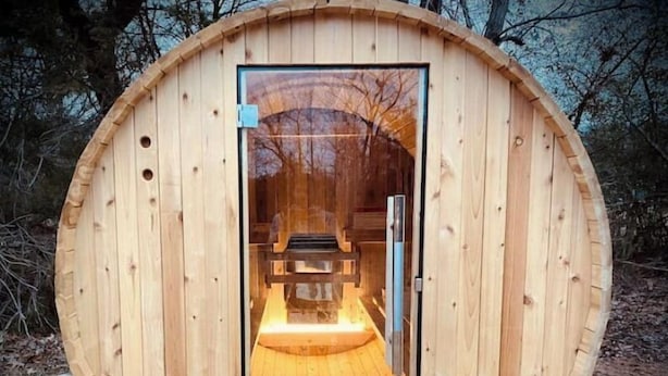 A wooden sauna with a glass door, a bench inside, and a wooden floor. - Tatum’s Retreat -SAUNA- Hiking-Wineries- Unit B (Madison)