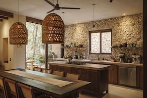 Enjoy cooking in this well-equipped kitchen with a central island, stove, and dishwasher.