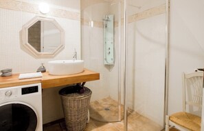 Shower, hair dryer, towels, soap