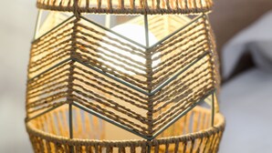 A close-up of a woven, geometric-patterned light fixture. - Django 400 m du lac (Annecy)