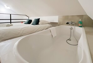 Bathtub, hair dryer, towels, soap