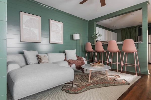 Welcome to your downtown Charleston rental! Plenty of seating space for your group in the living room :)