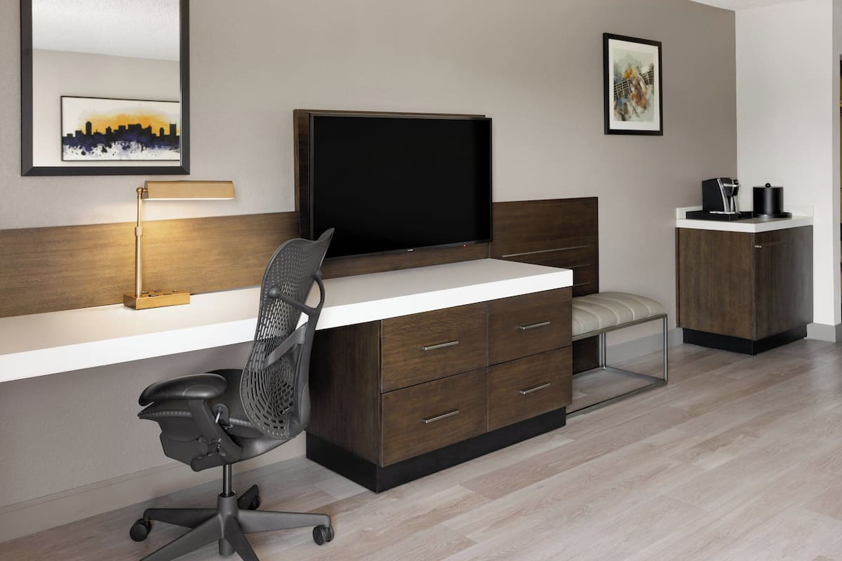 Desk, laptop workspace, blackout drapes, iron/ironing board