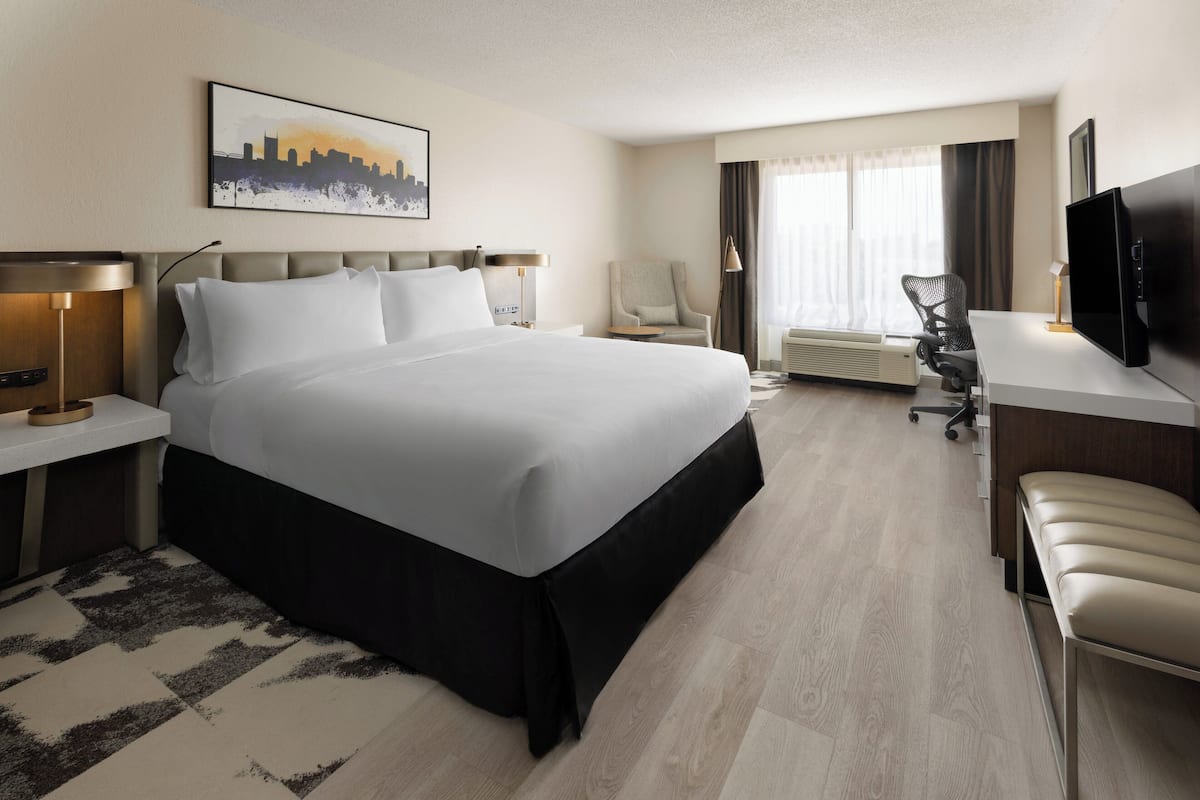 Desk, laptop workspace, blackout drapes, iron/ironing board