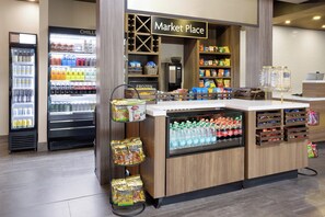 A market place with refrigerated drinks, snacks, and beverages. - Crowne Plaza Nashville Airport by IHG (Nashville)