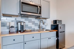 Fridge, microwave, coffee/tea maker, toaster