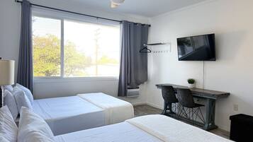 1 bedroom, desk, iron/ironing board, travel crib